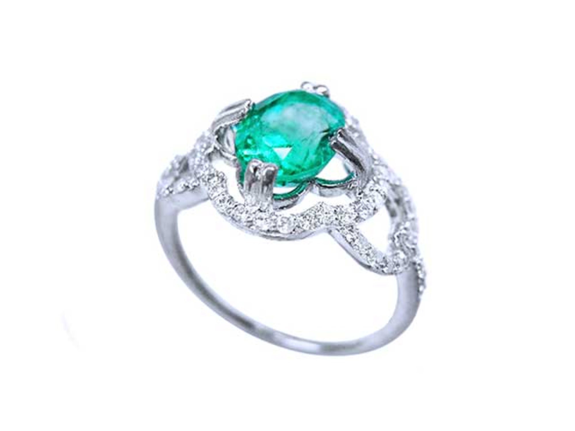 A detailed view of an oval cut emerald centered in a clover ring design adorned with diamonds.