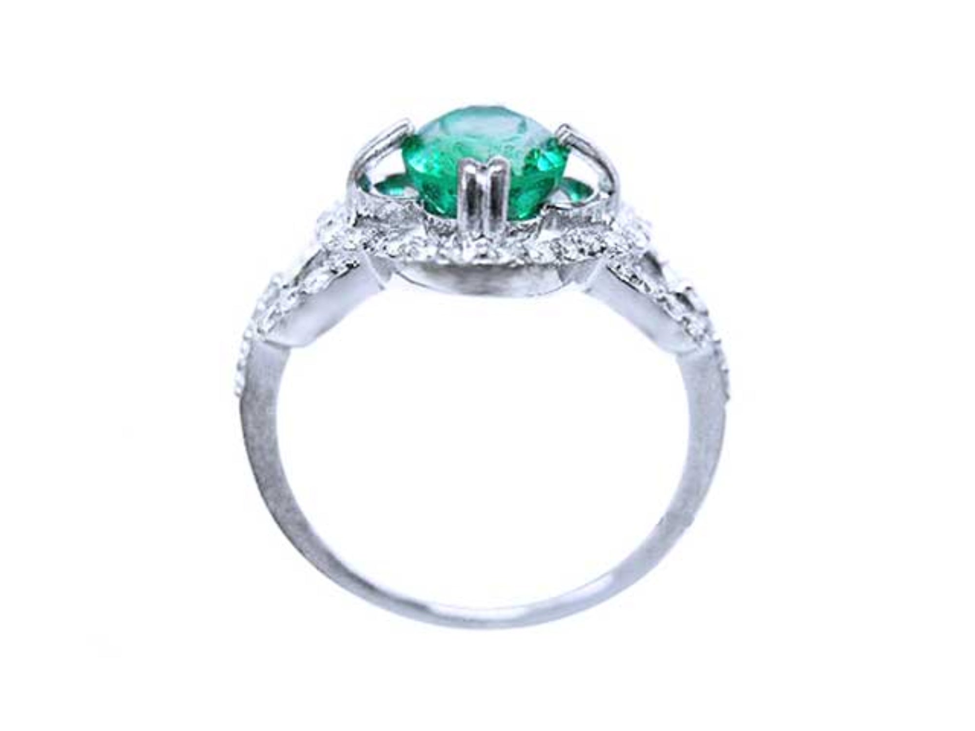This ring displays the oval cut emerald highlighting the top, side gallery, and band.