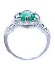 This ring displays the oval cut emerald highlighting the top, side gallery, and band.