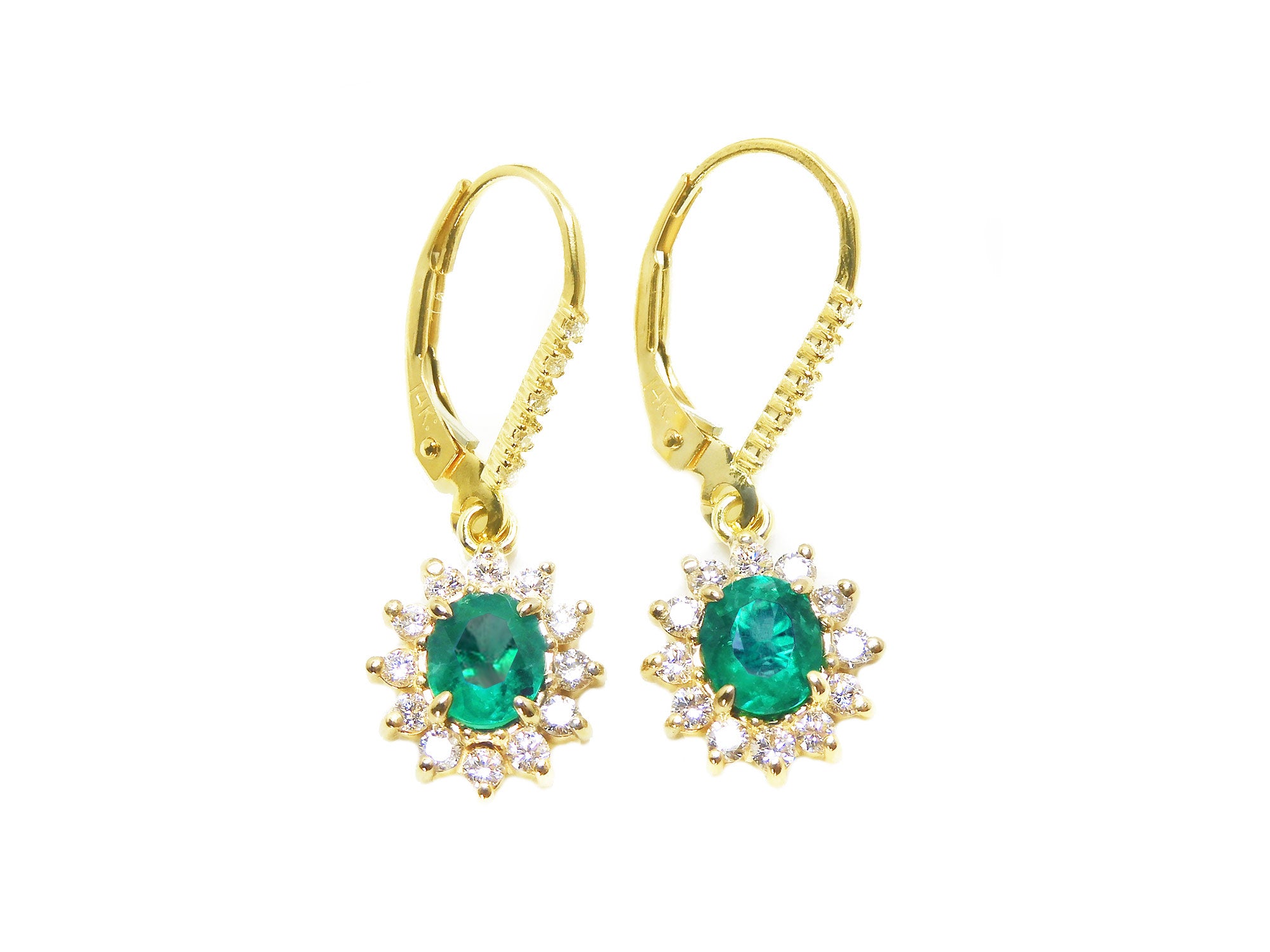 Front position of a pair of oval cut emerald earrings, halo diamonds in yellow gold, top side view