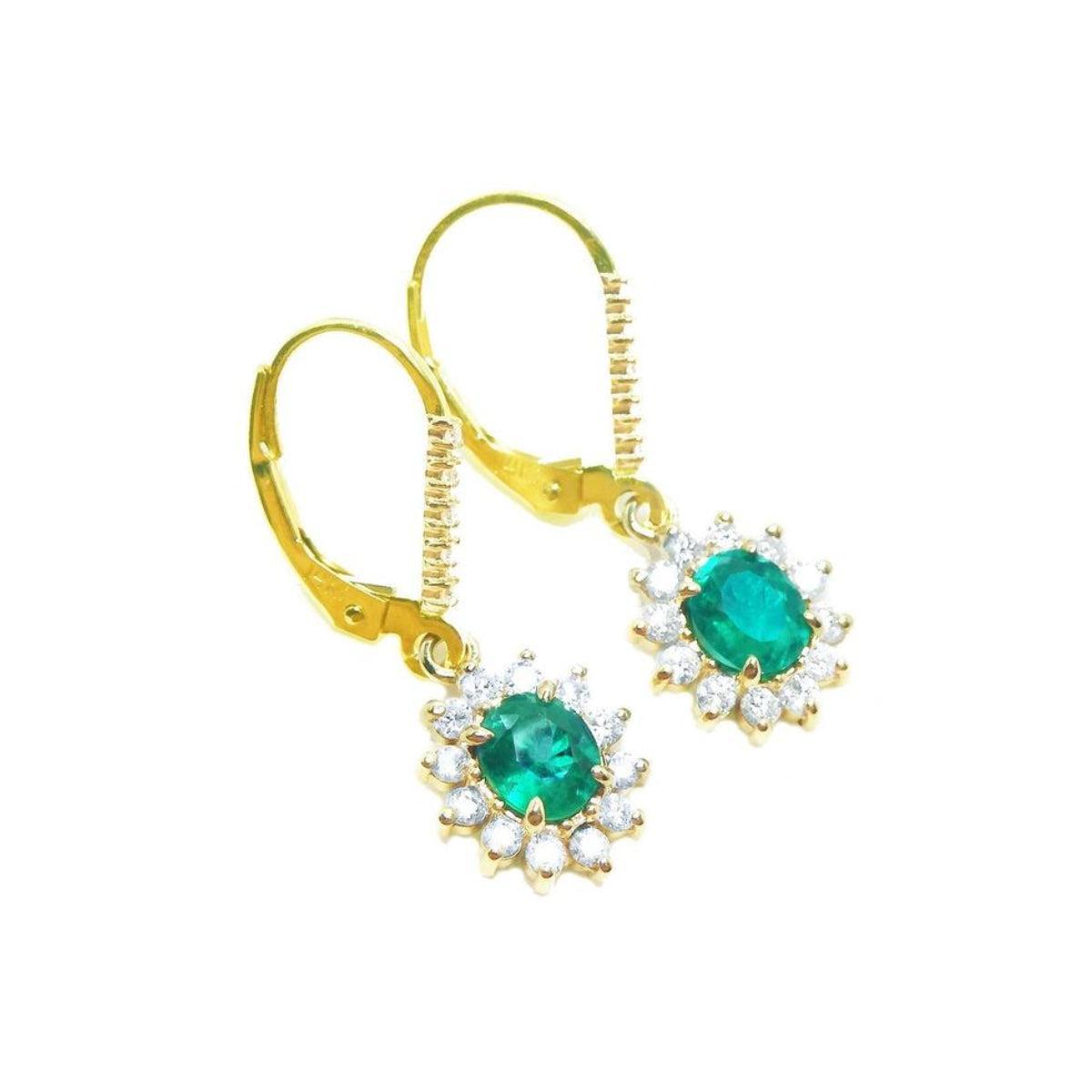 Gold earrings with oval cut natural emeralds and halo diamond in 14k yellow gold right side top view