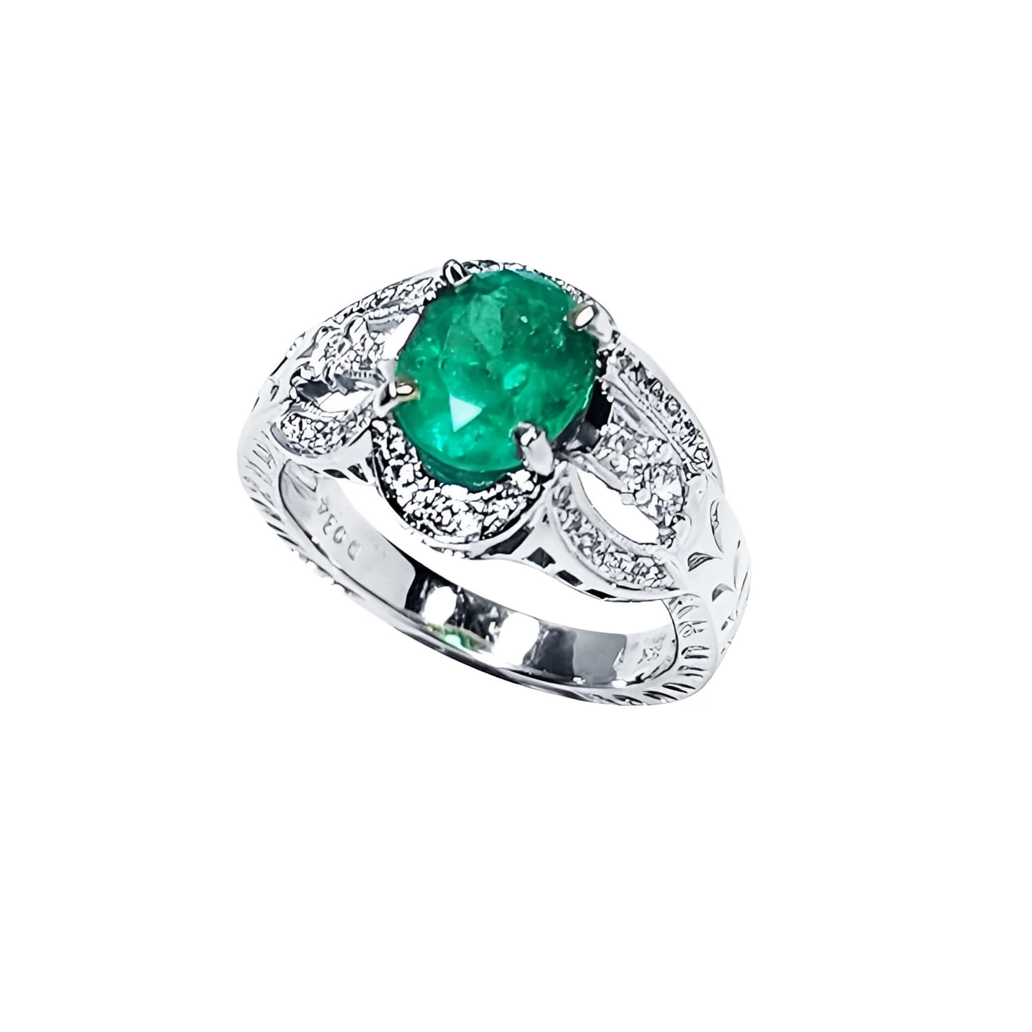 Natural oval emerald ring in 18K white gold with a decorative, diamond-accented band.