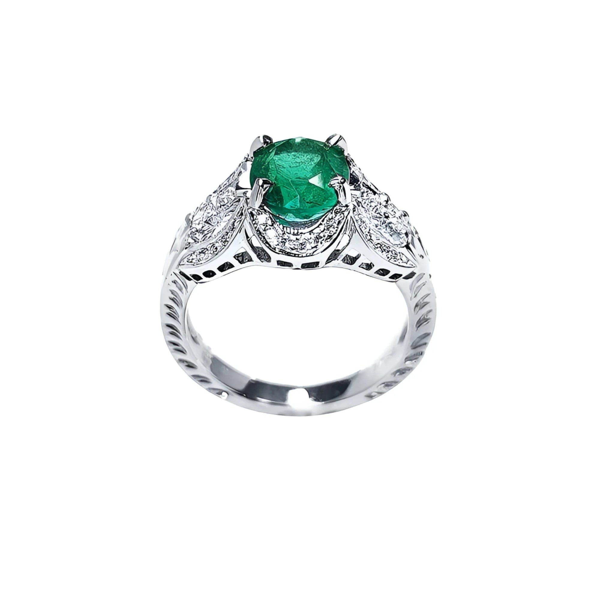 Natural oval emerald ring in 18K white gold with a decorative, bridal-style diamond band.