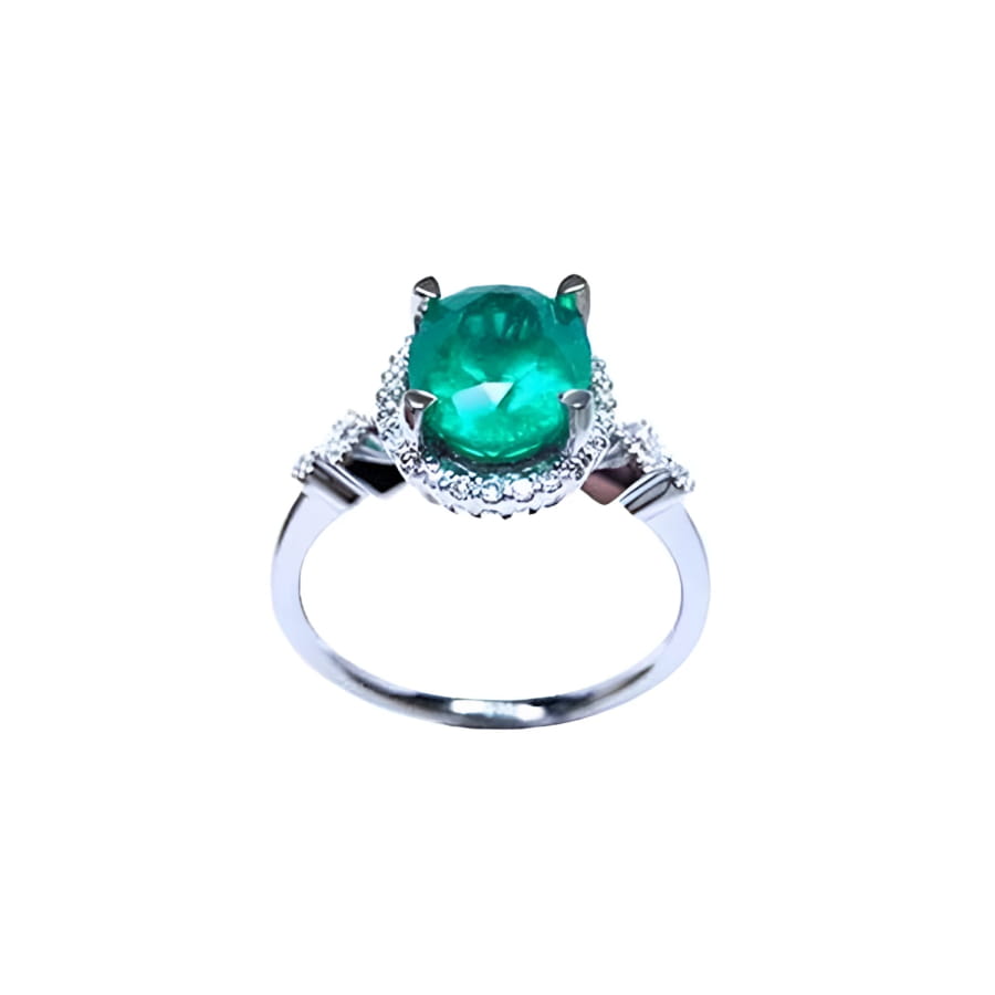 14K white gold halo ring with a deep green oval-cut emerald and sparkling diamond accents.