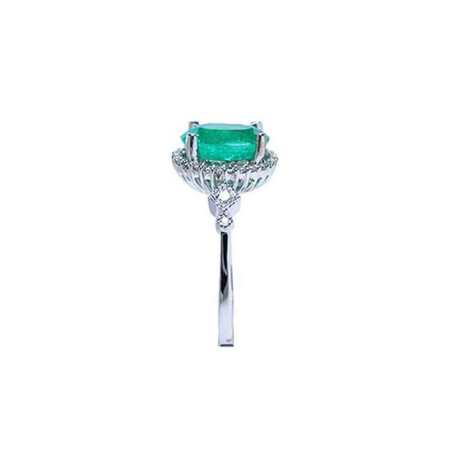 14K white gold halo ring with a 2.02 ct. oval-cut deep green emerald and natural diamonds.