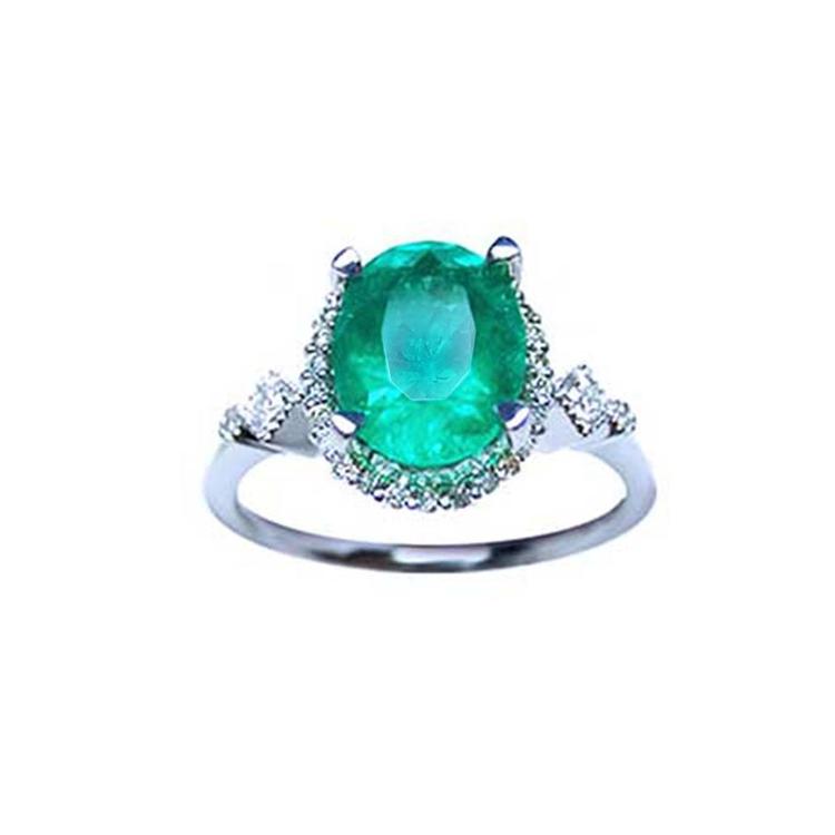Oval emerald ring, with accent diamonds, made of 14k white gold perfect for mother's day gift.
