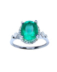 Oval emerald ring, with accent diamonds, made of 14k white gold perfect for mother's day gift.