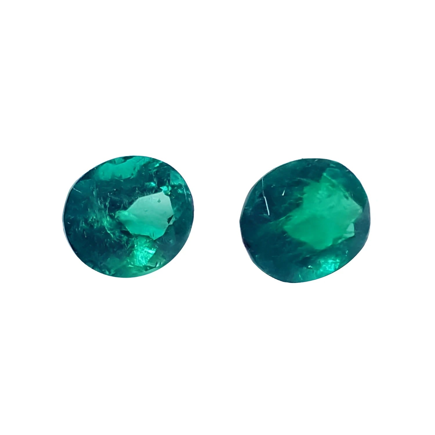 1.60 cttw. oval cut natural loose emeralds matched pair, deep bluish-green hue.