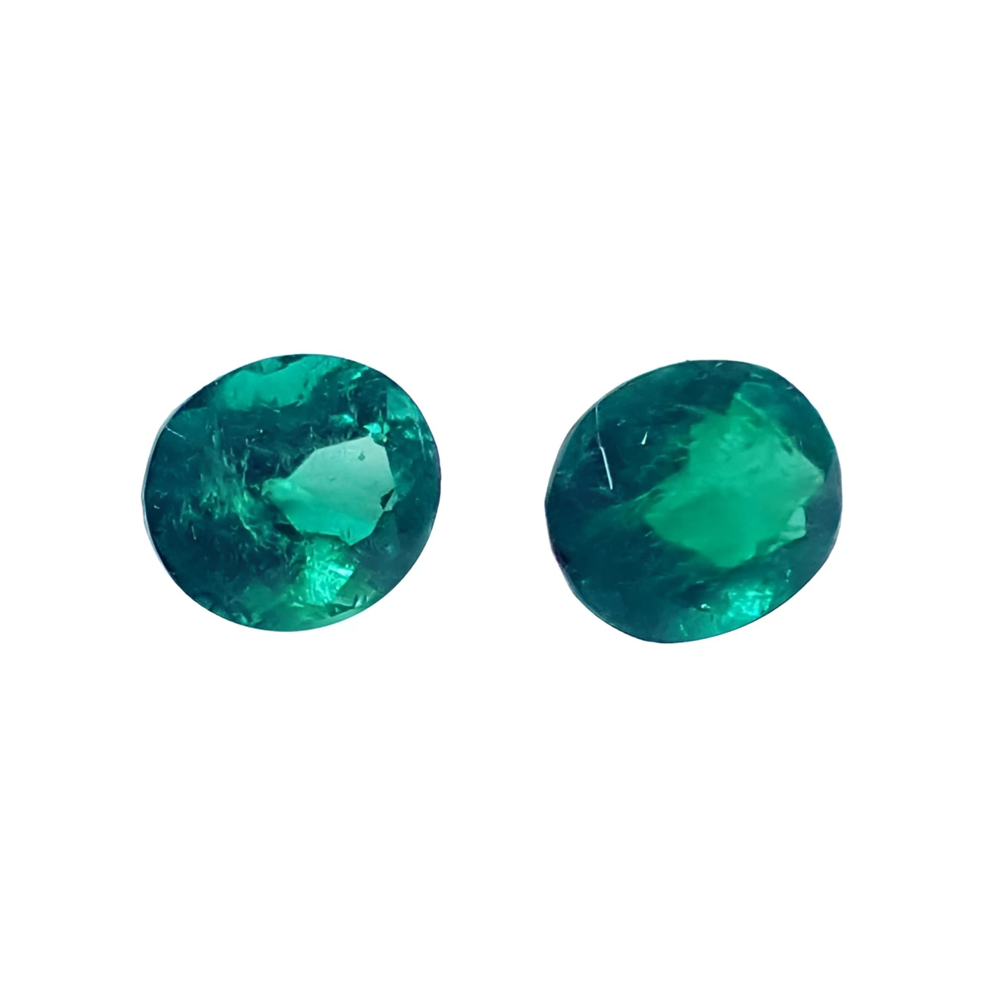1.60 cttw. oval cut natural loose emeralds matched pair, deep bluish-green hue.