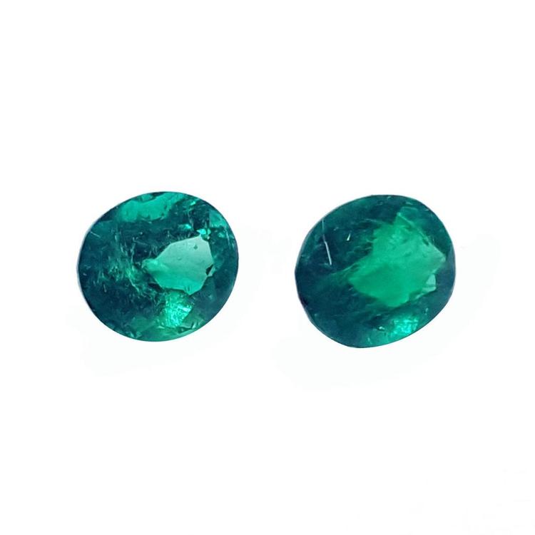 1.60 cttw. oval cut natural loose emeralds matched pair, deep bluish-green hue.