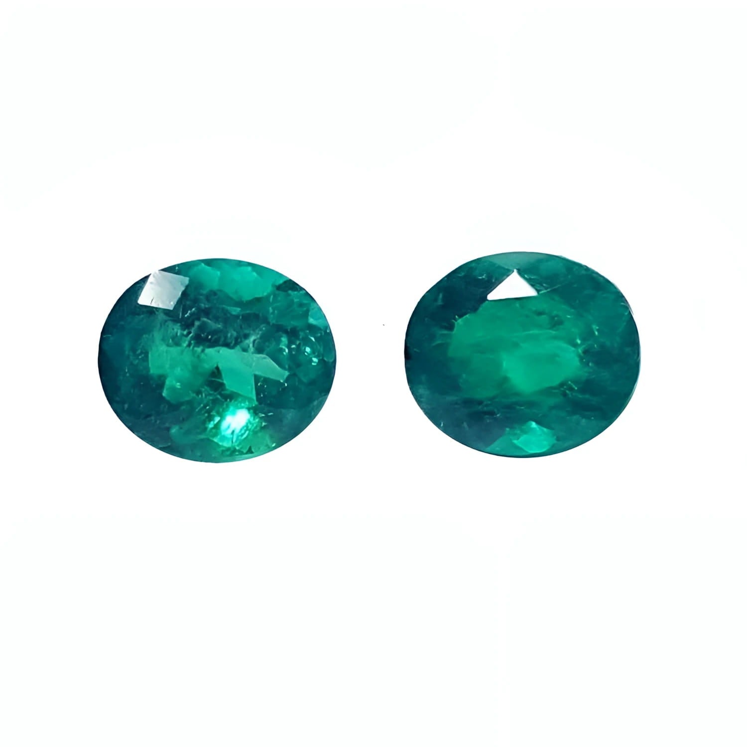 Oval cut matched pair loose natural emeralds 1.60 ct. from the Muzo mines in Colombia, sparkling deep bluish green hue.