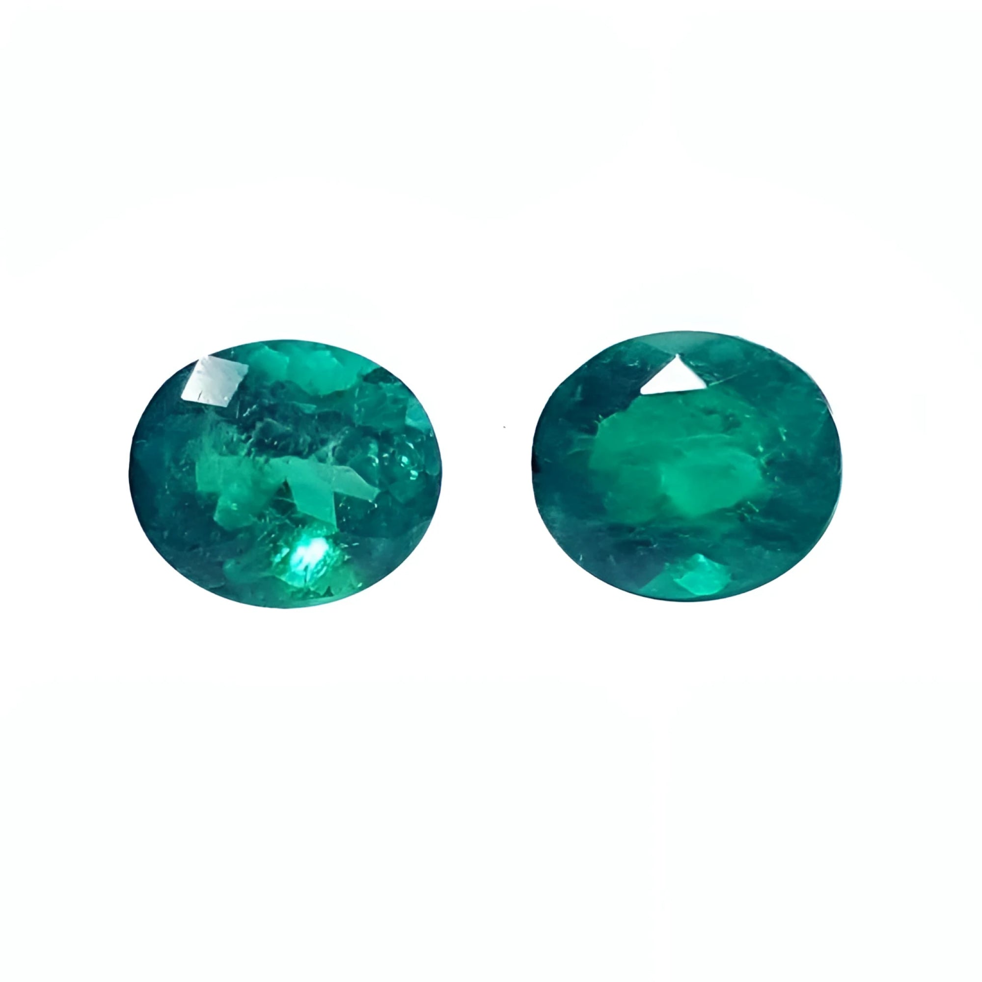 Oval cut matched pair loose natural emeralds 1.60 ct. from the Muzo mines in Colombia, sparkling deep bluish green hue.