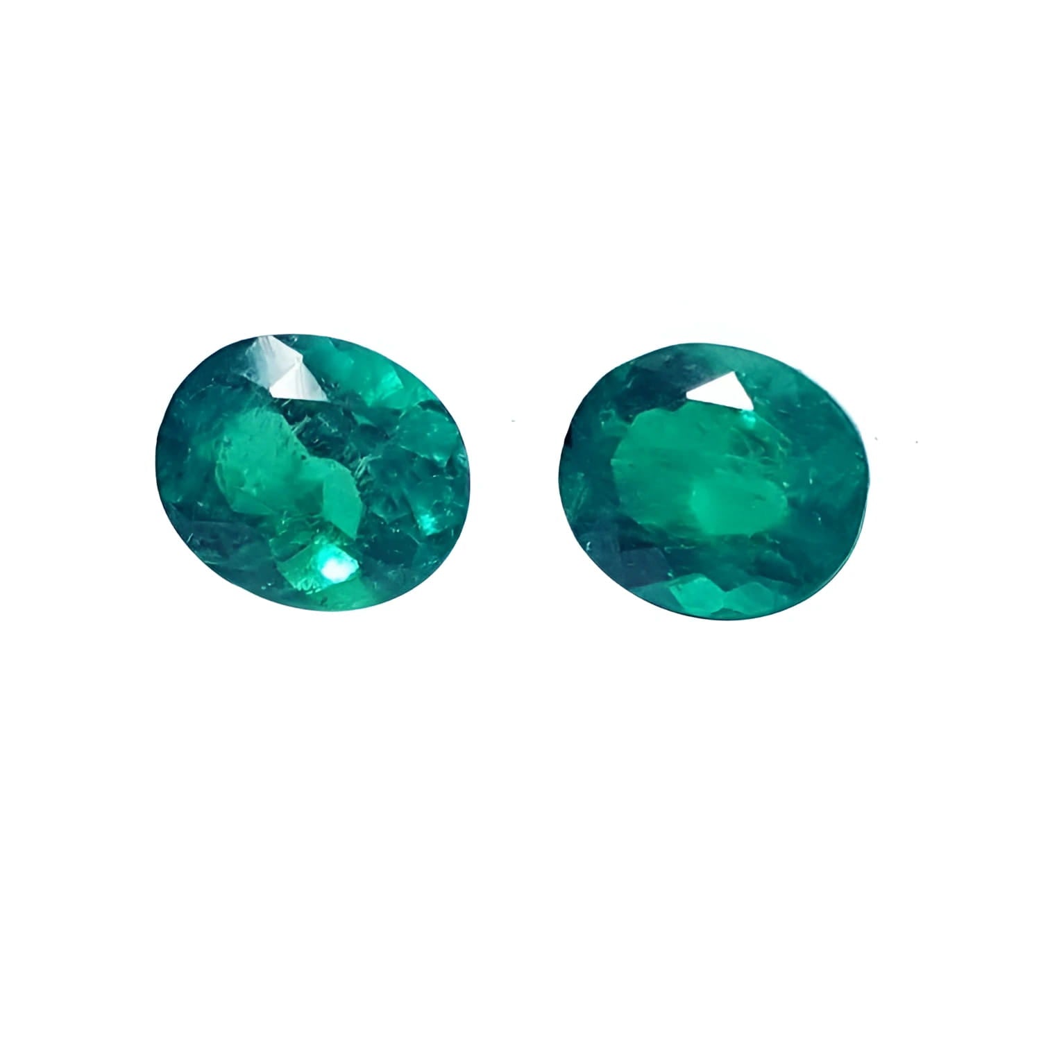 Oval cut matched pair loose natural emeralds for a unique design of emerald earrings.