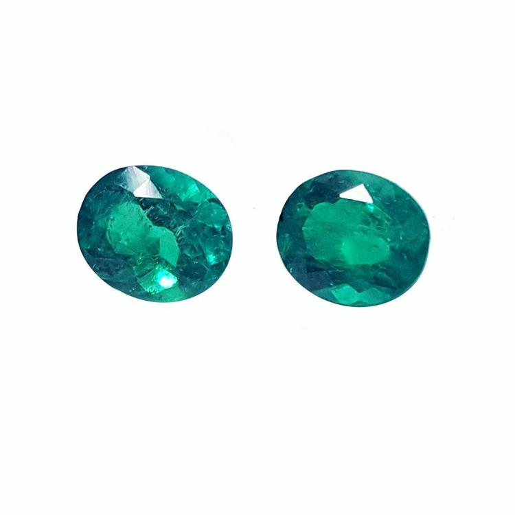 Oval cut matched pair loose natural emeralds for a unique design of emerald earrings.