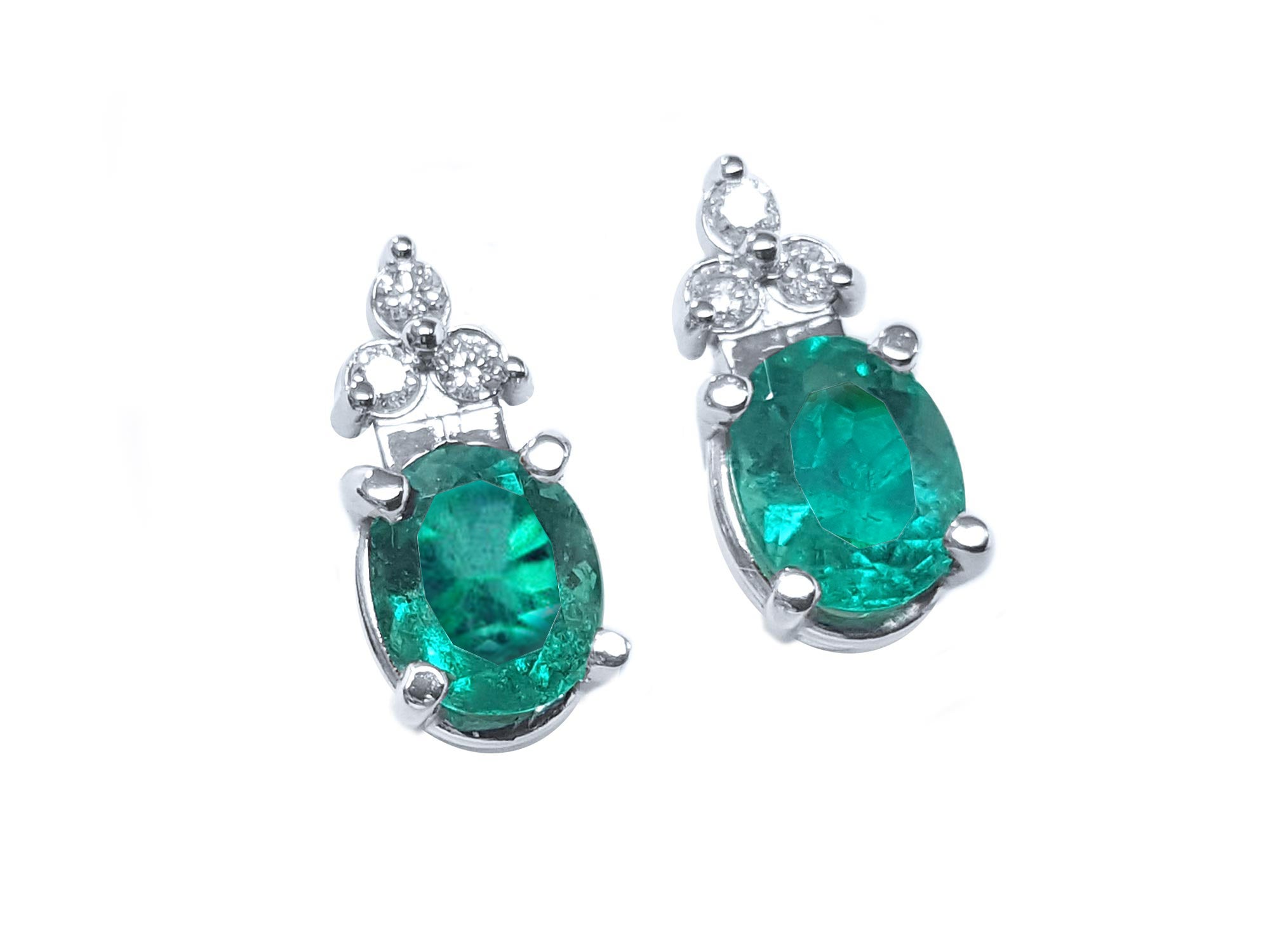 Pair of emerald earrings oval cut right side tables and crowns are visibles