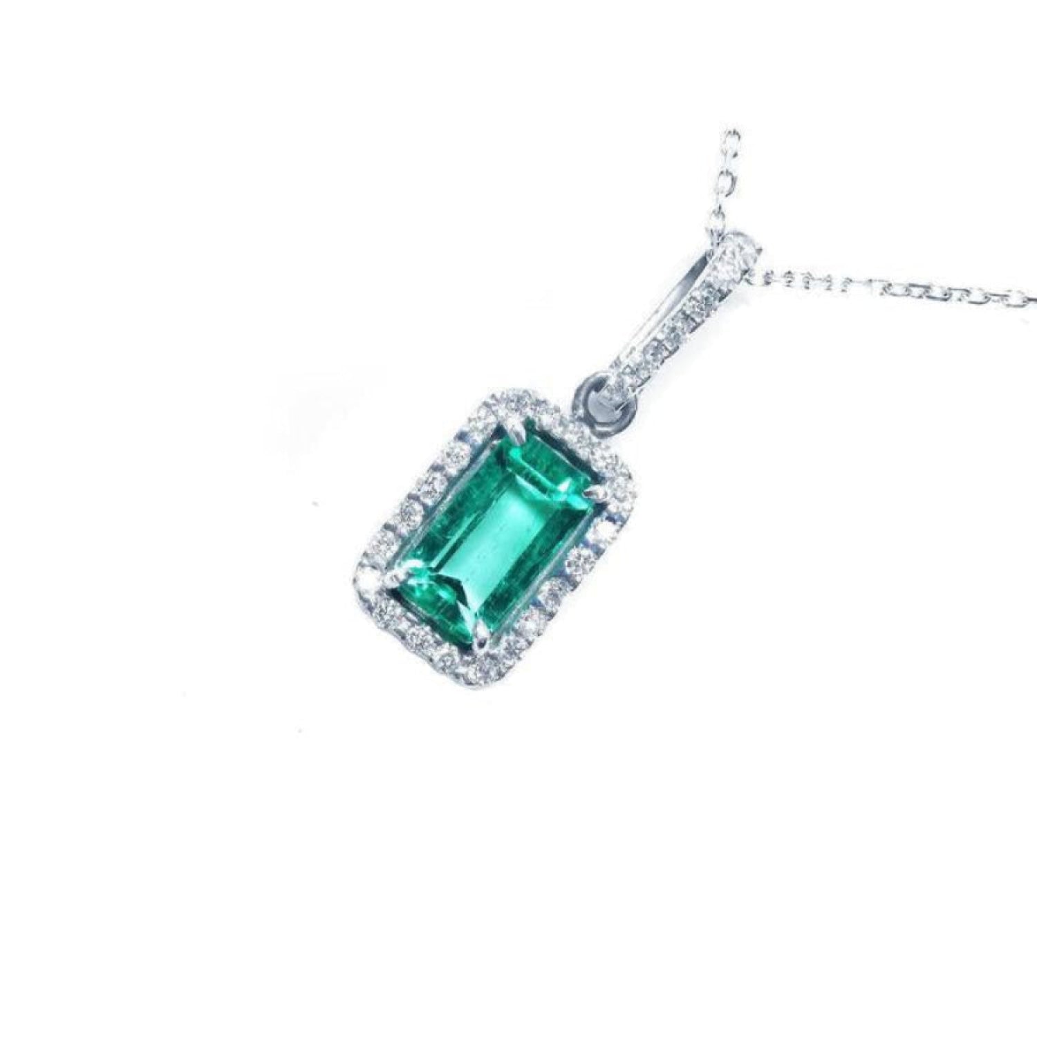 1.70 ct Muzo Colombian emerald pendant with diamond halo in 18K white gold.