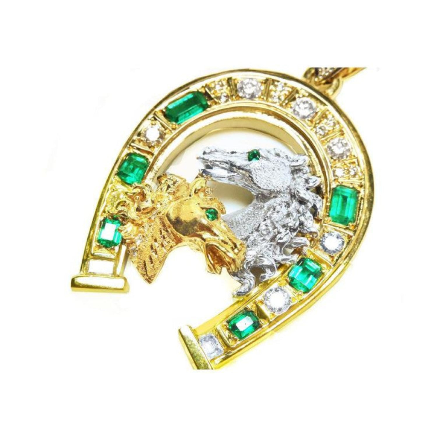 18K yellow gold horseshoe pendant with emeralds, diamonds, and two horse heads.