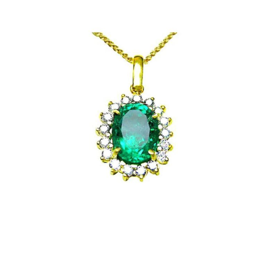 Oval 3.01 ct. natural emerald pendant with halo diamonds in 18K yellow gold.