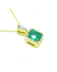 1.99 ct. cushion-cut emerald halo pendant with natural diamonds on a 14K yellow gold chain.