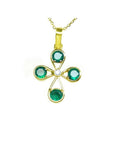 A natural four round stone colombian emerald cross pendant hand made of 18k yellow gold.