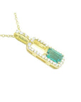 18K yellow gold emerald-cut emerald pendant necklace with diamond halo.