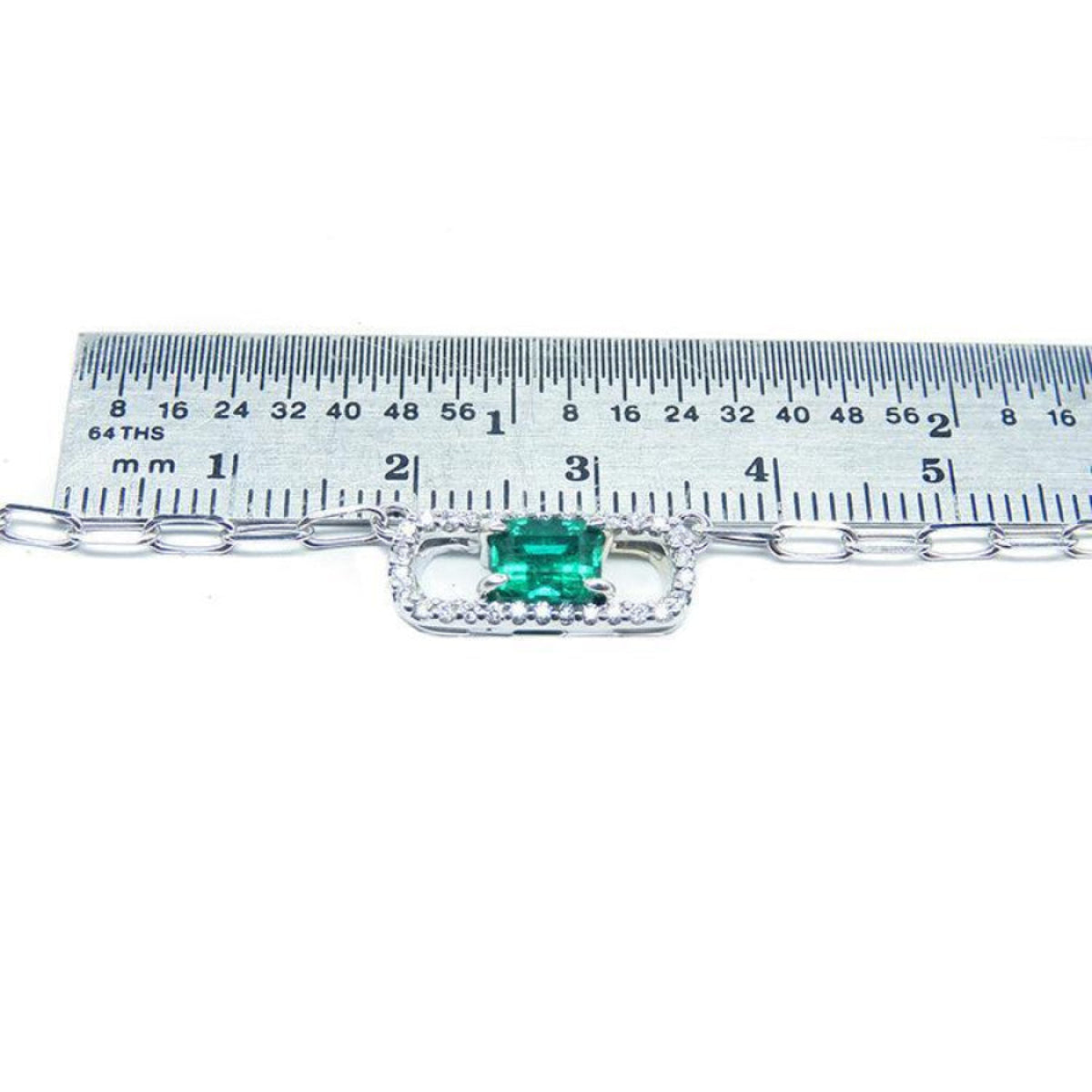 Emerald paper clip necklace with diamonds in 18K white gold, shown with ruler for scale.