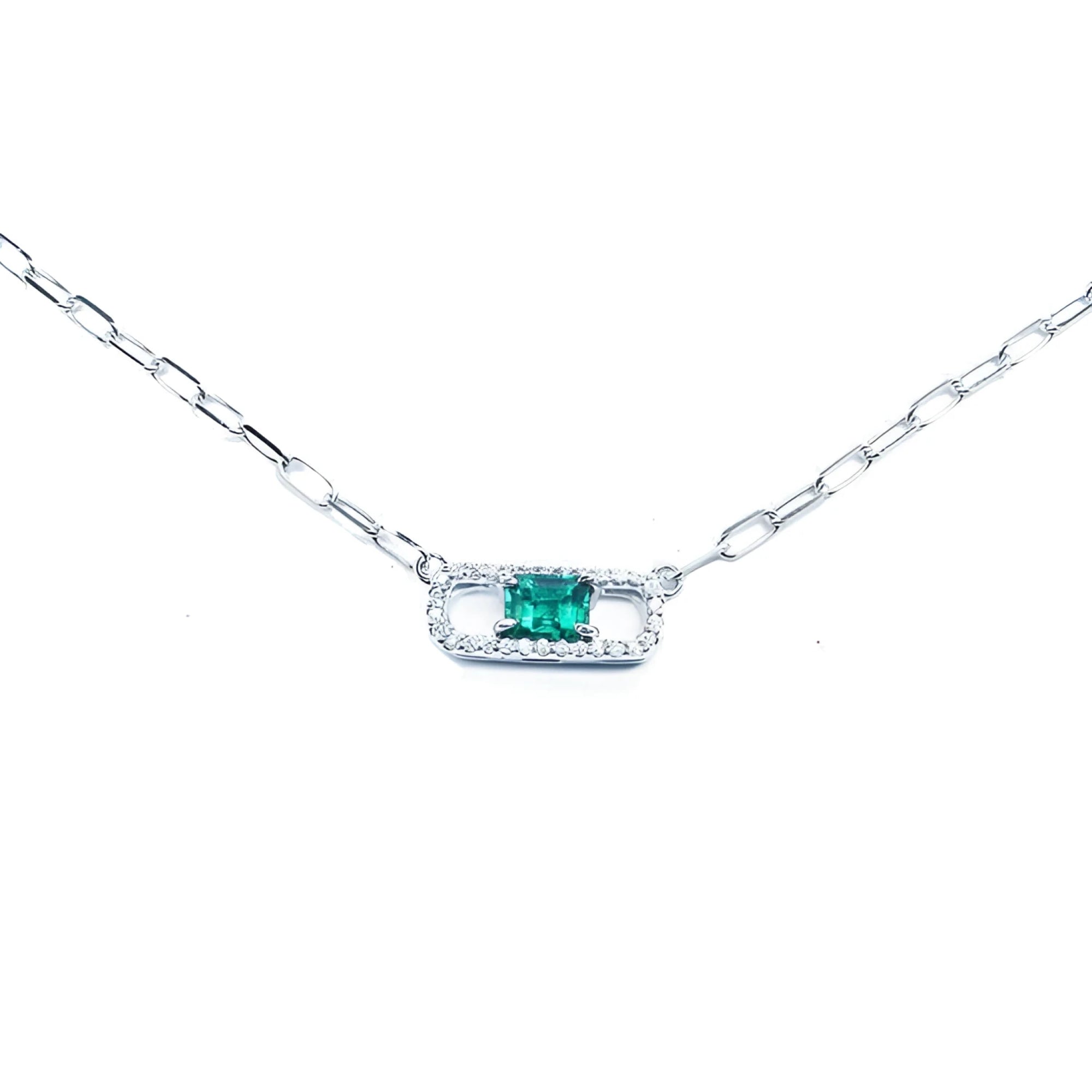 18K white gold paper clip necklace with a vibrant rectangular emerald and diamond halo.