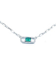 18K white gold paper clip necklace with a vibrant rectangular emerald and diamond halo.