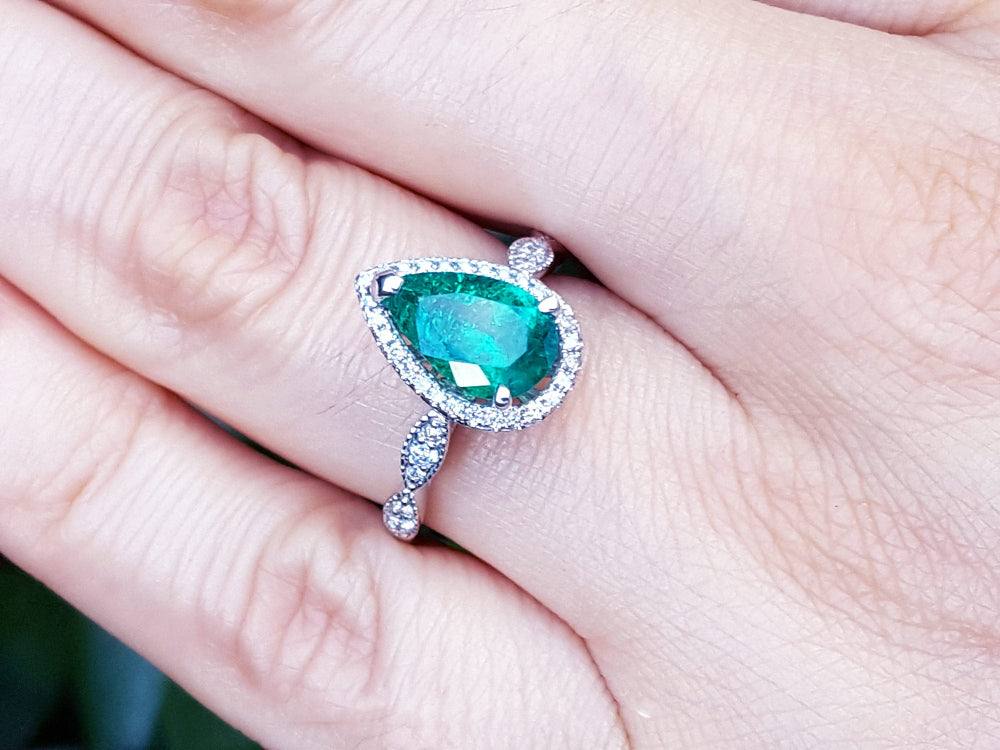 Bridal&#39;s style white gold emerald engagement ring pear cut halo diamond milgrain deco 14k white gold