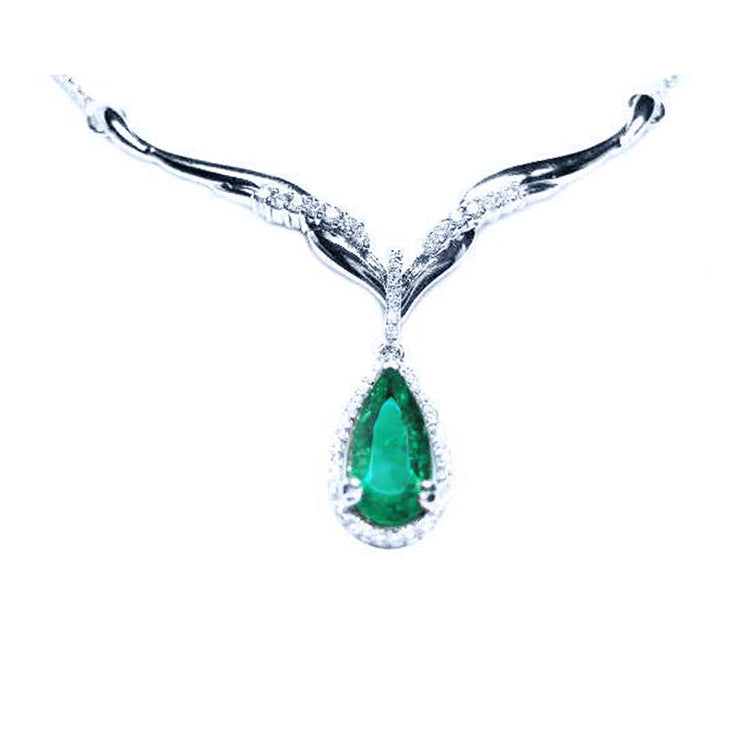 emerald necklace for lady's pear cut 1.28 carats sourced from Muzo mines encircled by a halo diamond crafted in 14k white gold