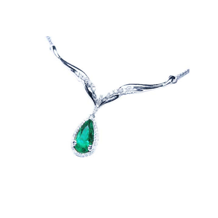 natural emerald necklace pear cut 1.28 carats sourced from Muzo mines encircled by a halo diamond crafted in 14k white gold