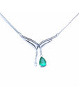 14K white gold necklace with a pear-shaped emerald and diamond chevron pendant.