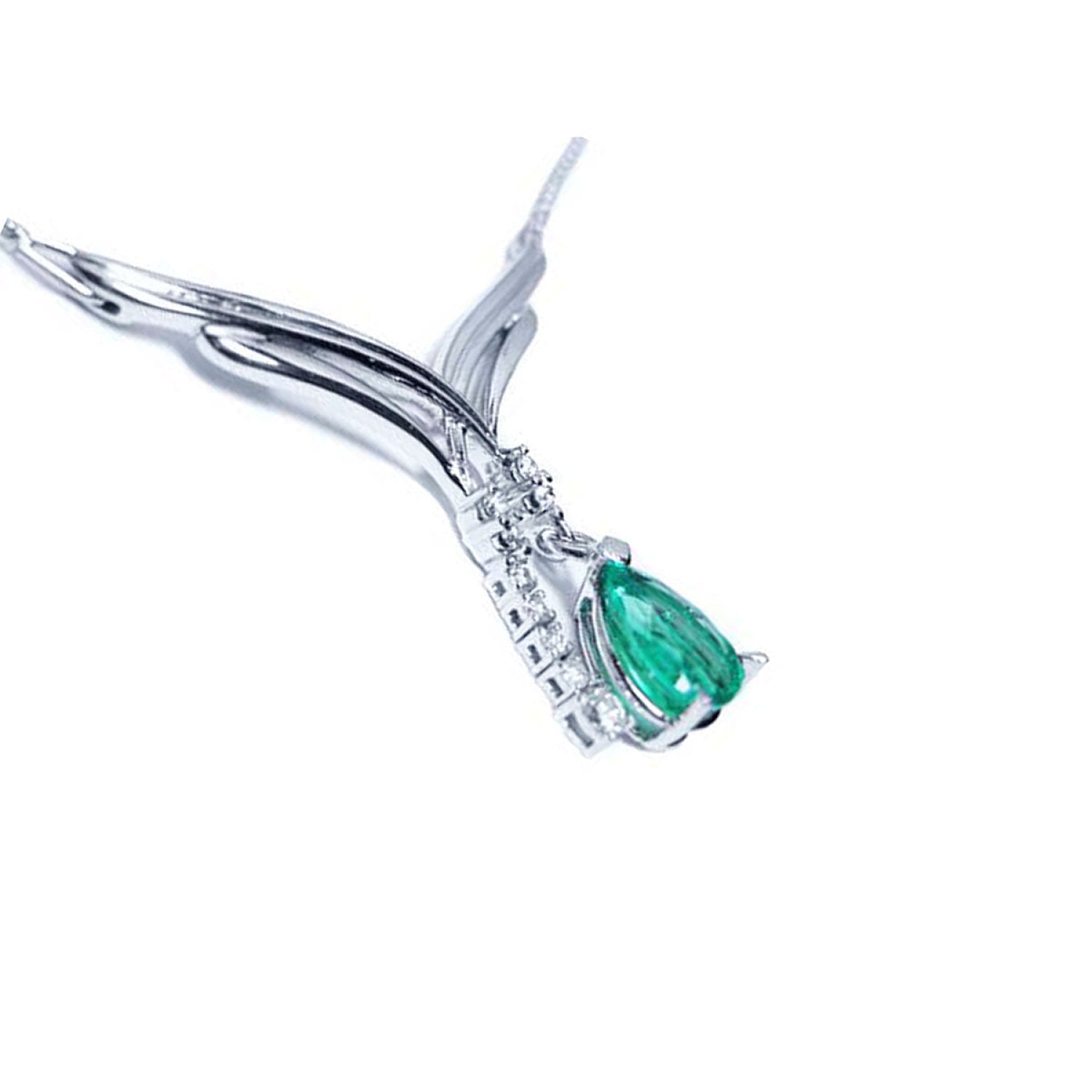 14K white gold necklace with a pear-shaped emerald pendant and diamond accents on a chevron design.