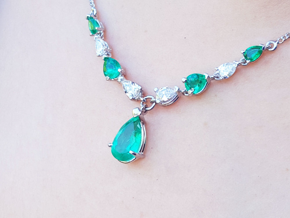 USA made women&#39;s emerald necklace for sale natural diamonds pear shaped individual settings complemented with a wheat style chain