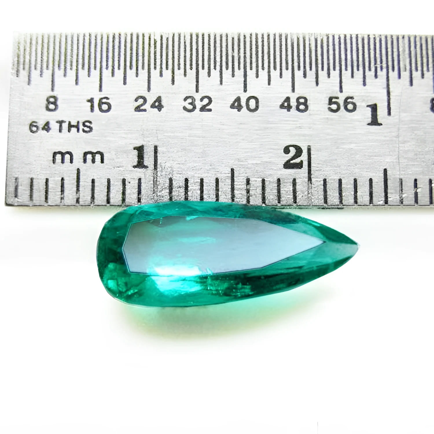 3.43 ct GIA certified natural pear-cut Colombian emerald, vibrant bluish-green, shown with a ruler.