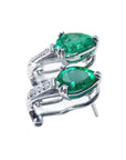 Pair of 14k white gold emerald clip on earrings pear cut left profile details