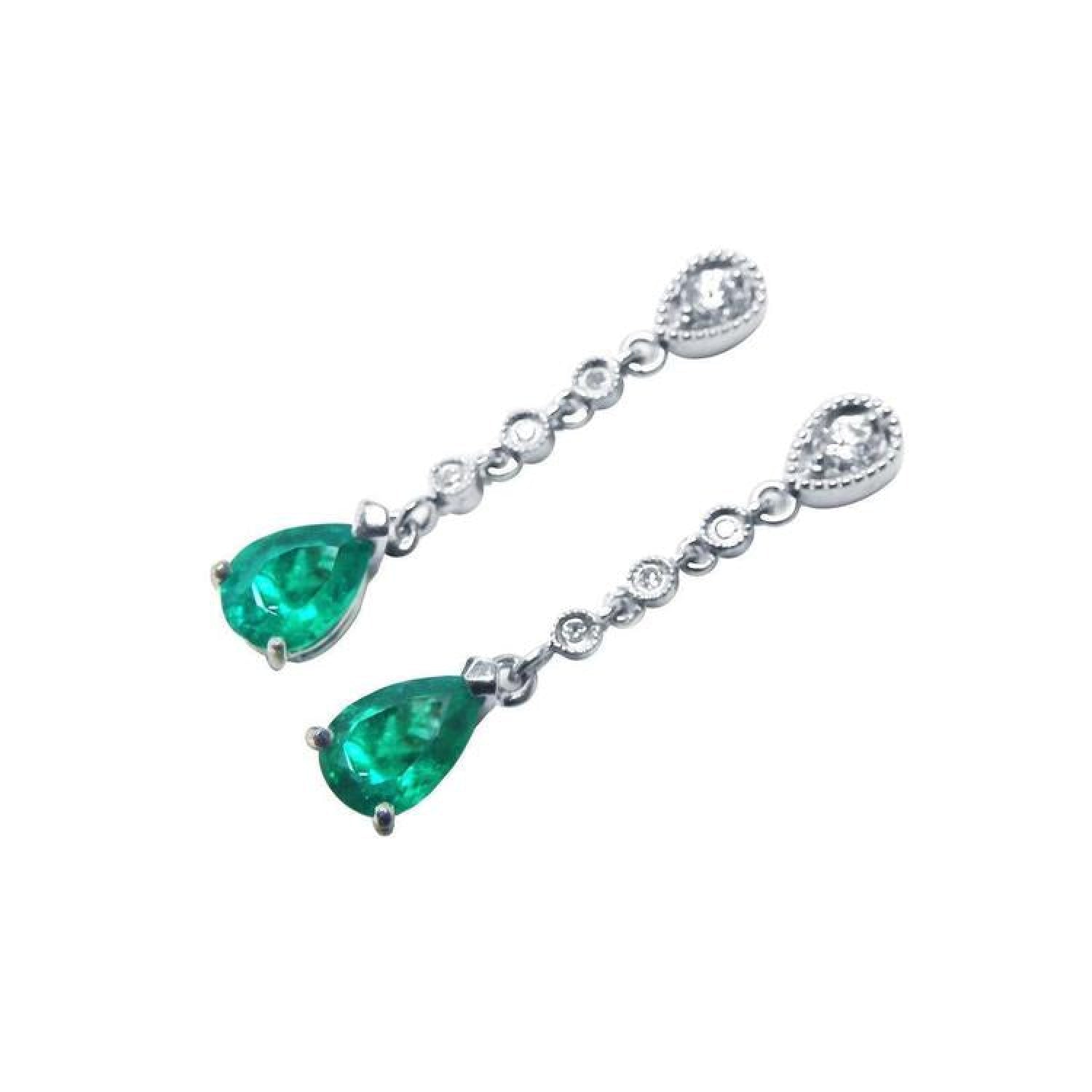 14K white gold pear-shaped emerald drop earrings with diamond accents.