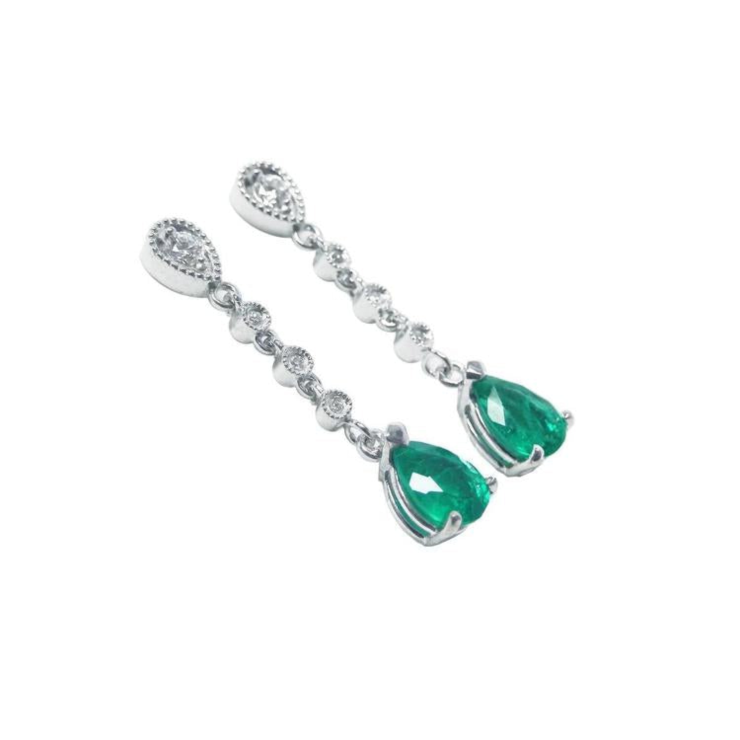 14K white gold drop earrings with brilliant diamonds and pear-shaped green emeralds.