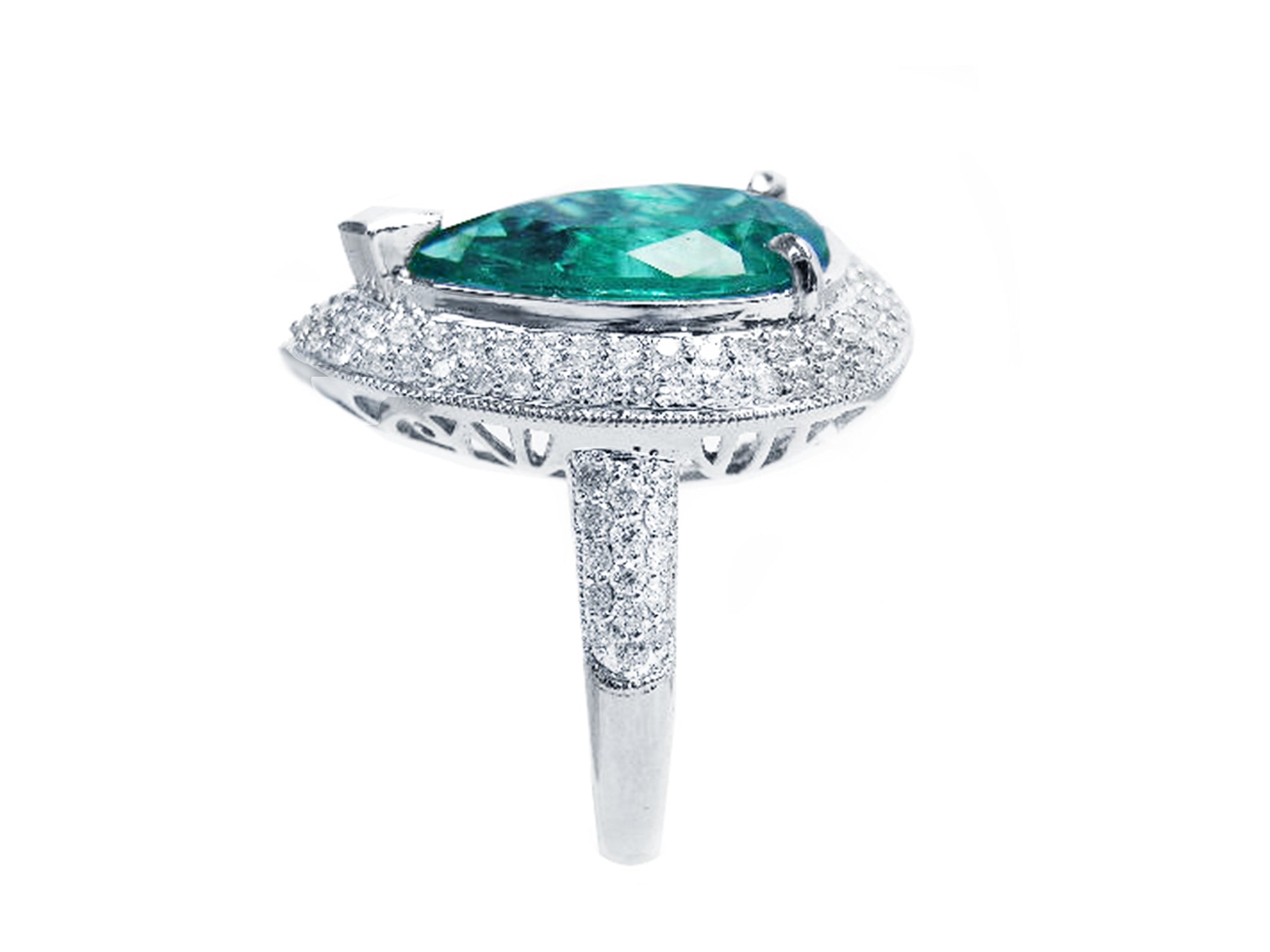 A pear shaped emerald and double halo diamond ring, in side profile position.