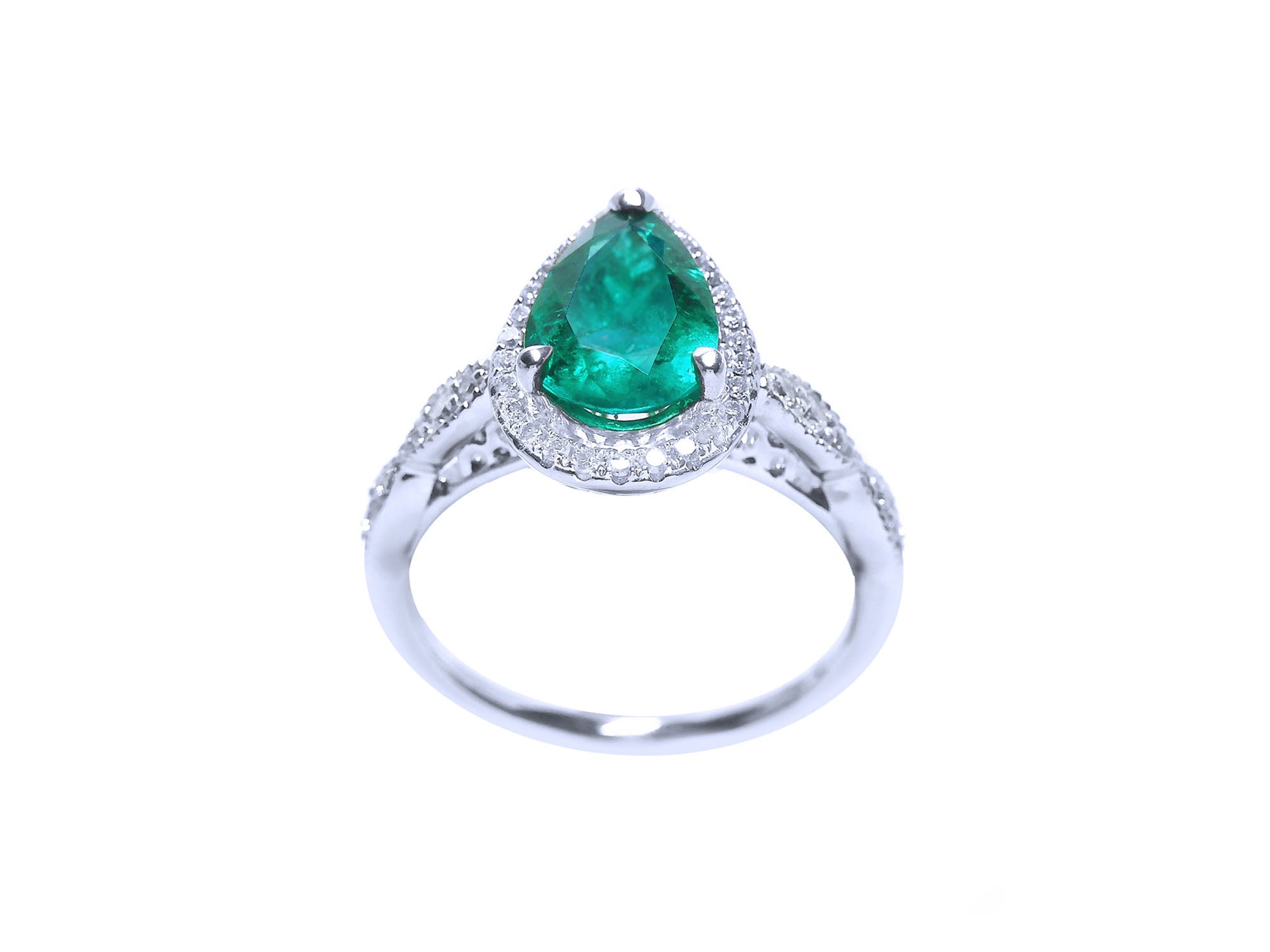 Pear cut emerald ring top and lateral gallery profile view on a white background.