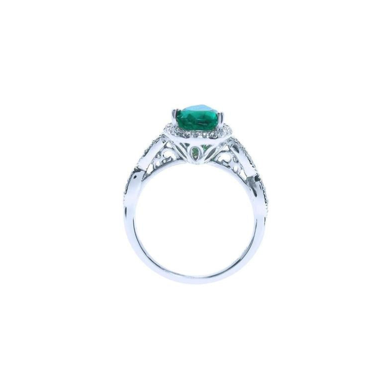 1.43 ct teardrop emerald engagement ring in 14K white gold with diamond halo and filigree band.