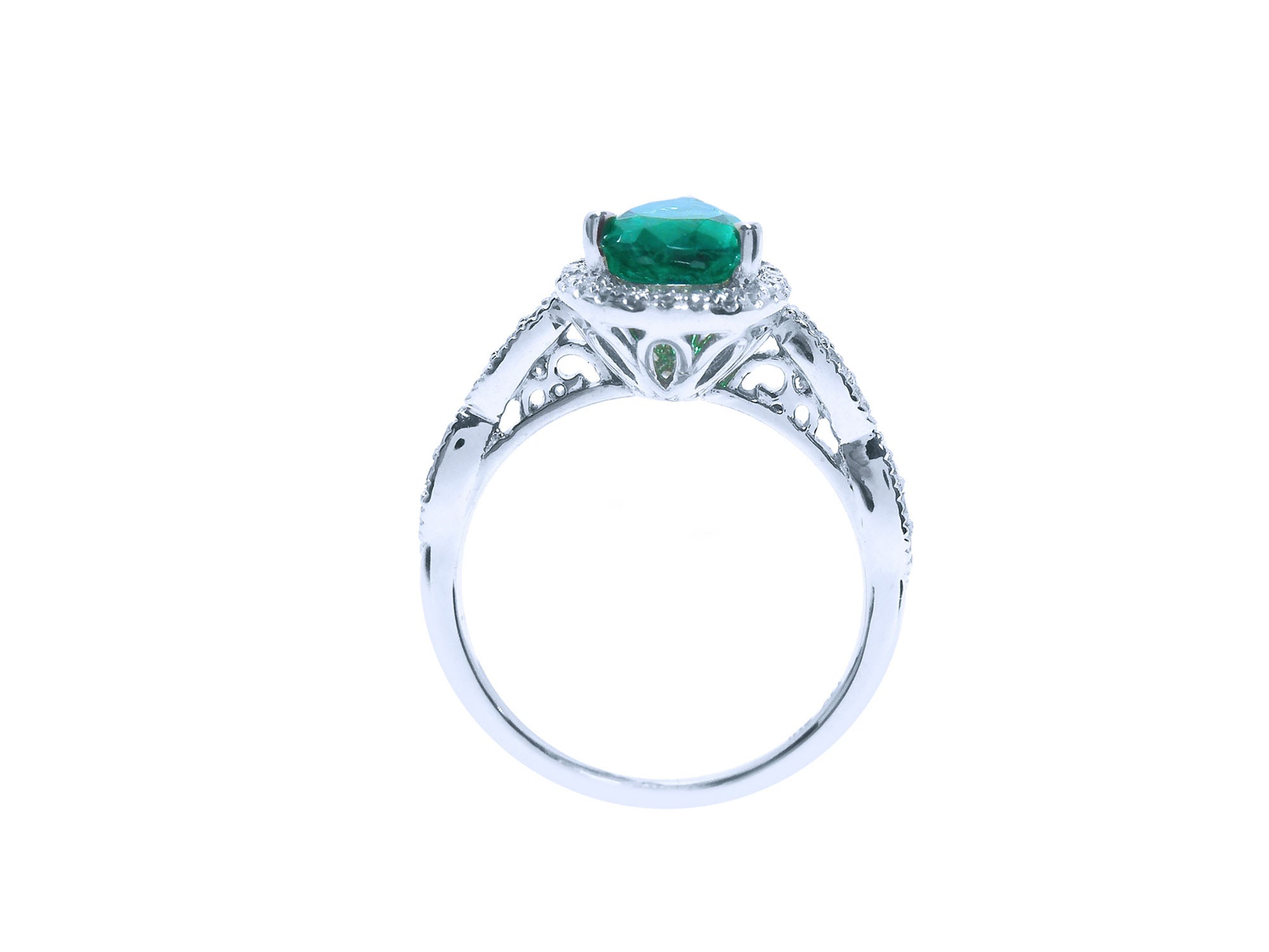 This white gold emerald ring displays its top and gallery profile on a white background.