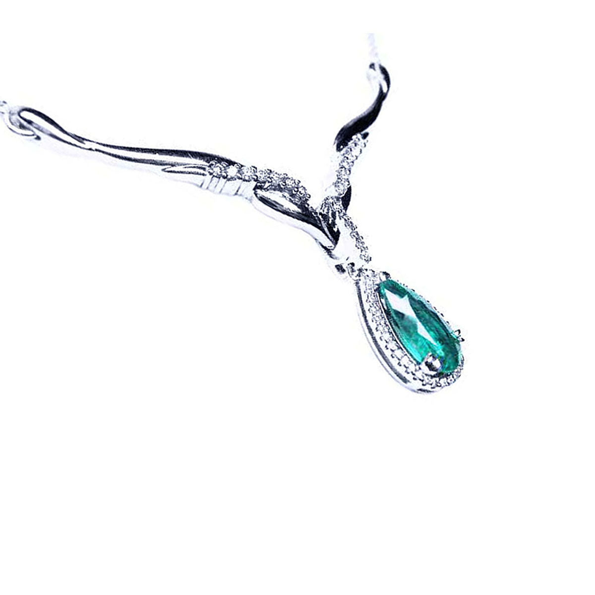 Left sight of a white gold women's emerald necklace pear cut encircled by a halo diamond on a white background