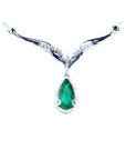 1.28 carat pear cut emerald necklace in 14K white gold with diamond halo and chevron design.