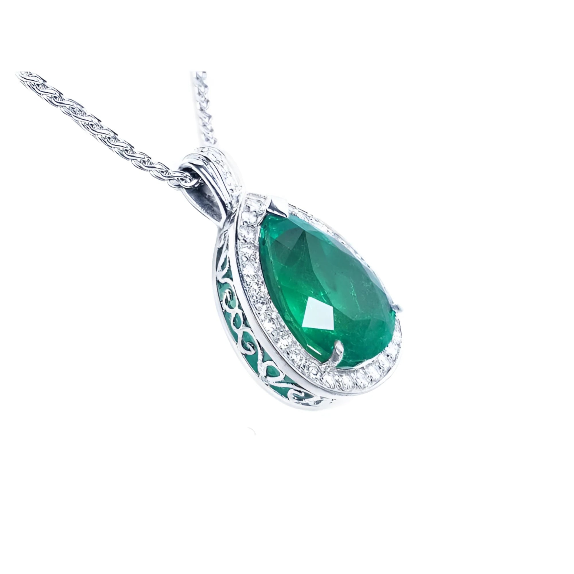 Pear-shaped emerald pendant with diamond halo and intricate 14K white gold setting on a chain.