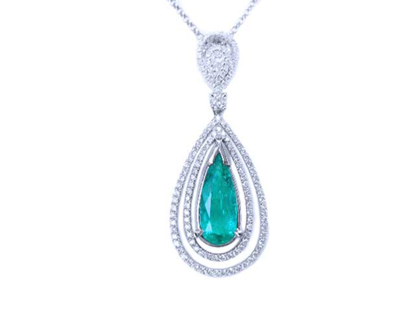 Teardrop-shaped emerald pendant with double halo diamond accents on a white background topside view.