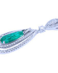 The side profile of a natural emerald teardrop with two rows of diamonds in white gold
