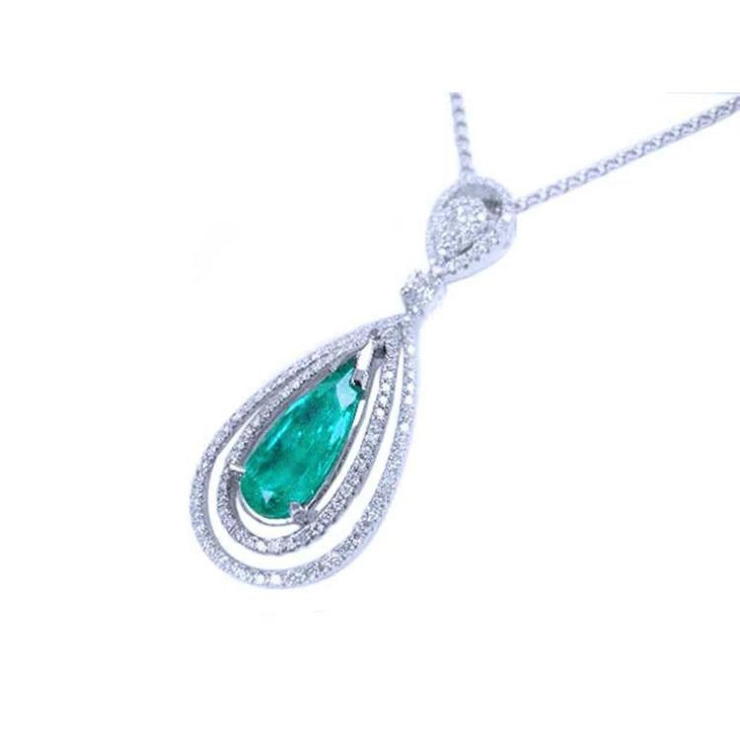 2.13 ct. teardrop emerald pendant with double diamond halo in 18K white gold.