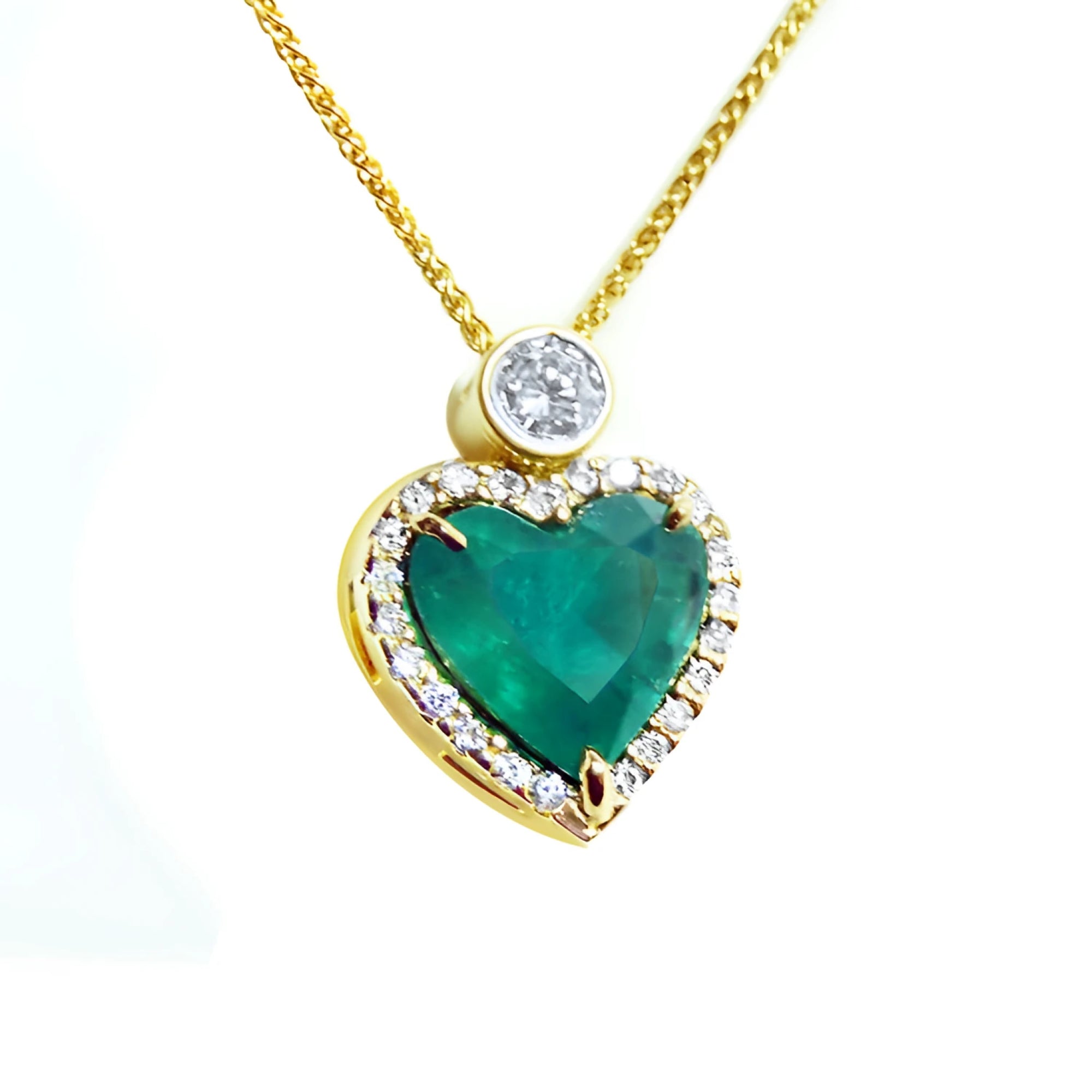 Pendientes o dijes en oro con esmeraldas colombianas y diamantes naturales para mujer.