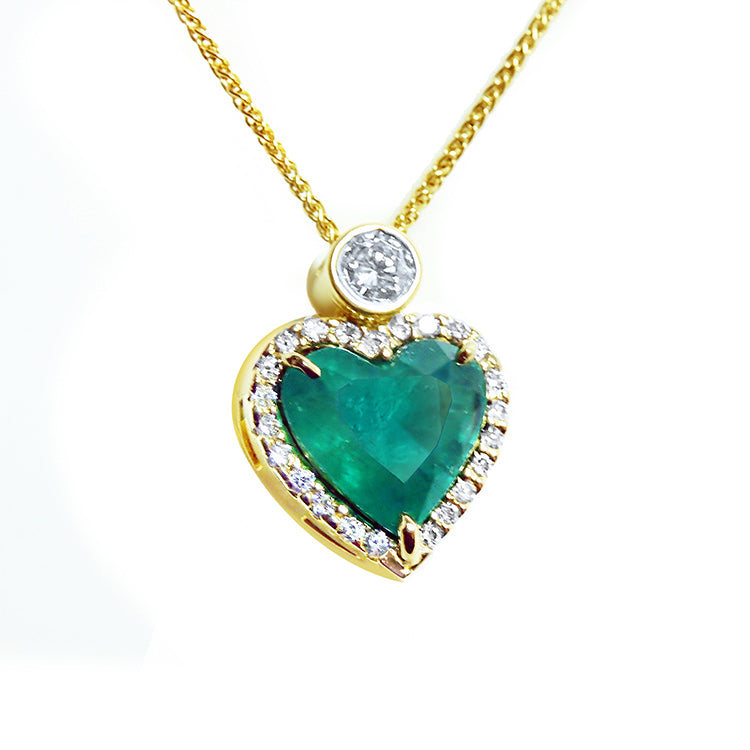 Pendientes o dijes en oro con esmeraldas colombianas y diamantes naturales para mujer.